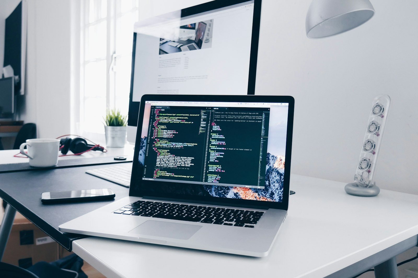 Laptop with code open on a desk